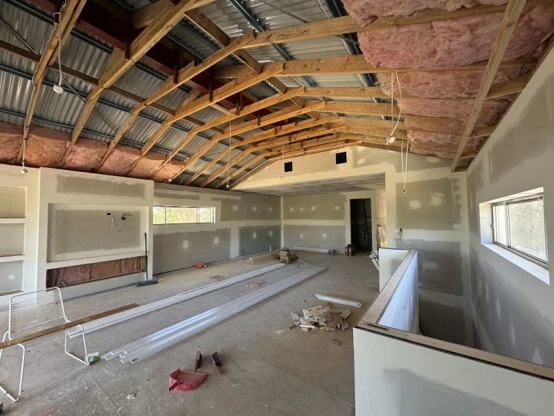 Under construction room featuring a partially built ceiling.